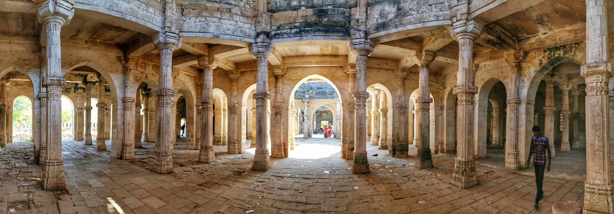 Pillared stone hall inside Uparkot Fort in Junagadh